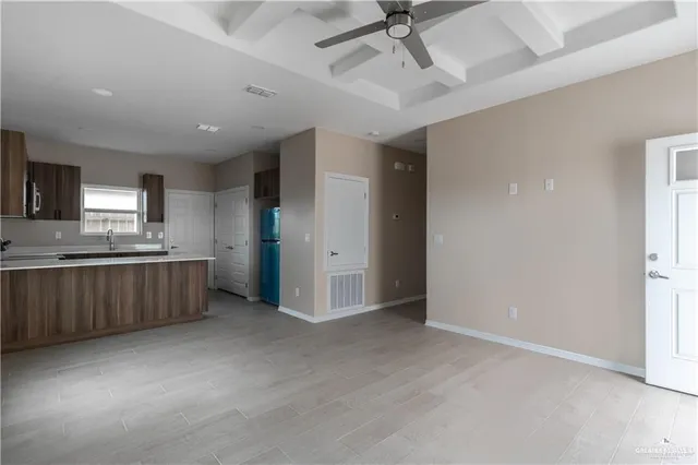 a view of a kitchen with a sink cabinets and window