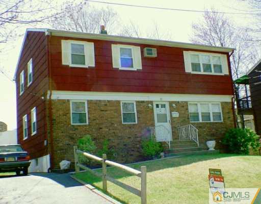 11 Long Hill Road Colonia, NJ 07067 - Photo 1 of 2 a front view of a house with yard