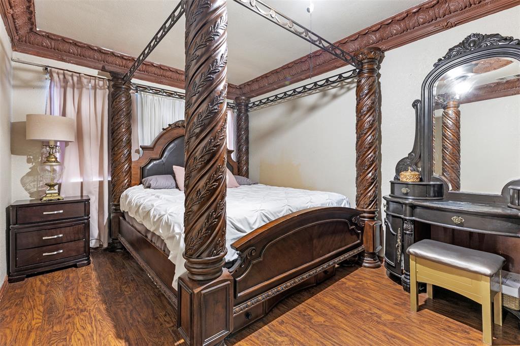 938 Gillham Road River Oaks, TX 76114 - Photo 7 of 20 a bedroom with a bed and a chair