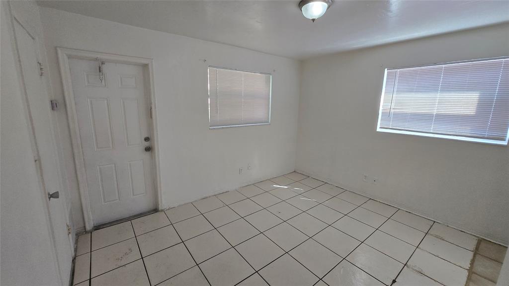 2501 Pierce Street, Unit 6 Hollywood, FL 33020 - Photo 3 of 5 a view of an empty room and window