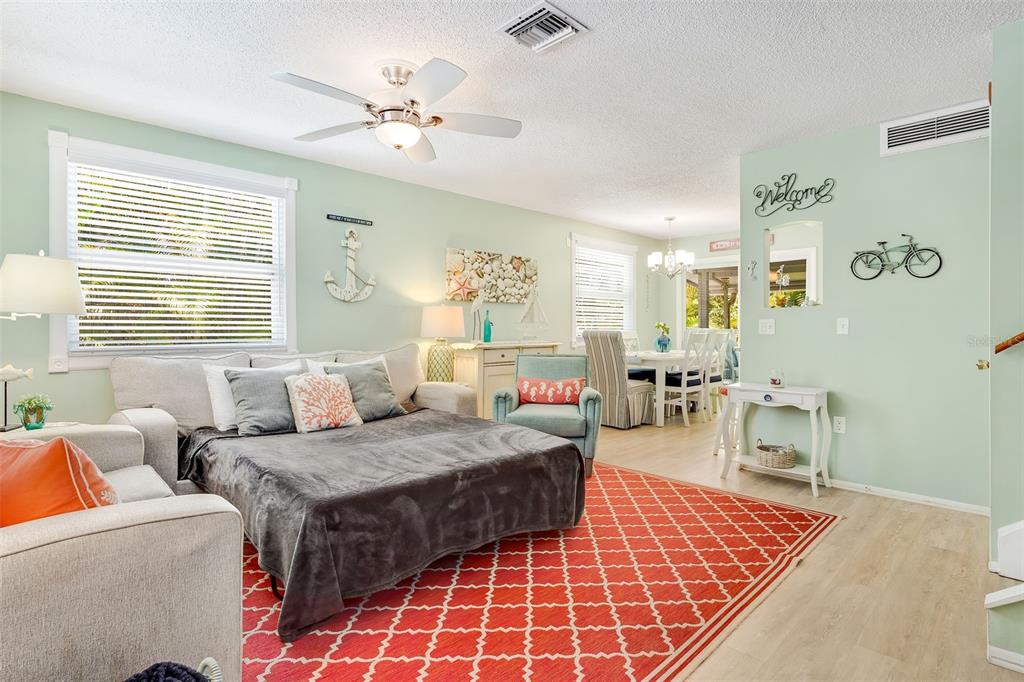 412 80th Street Holmes Beach, FL 34217 - Photo 15 of 58 a bedroom with furniture and a window