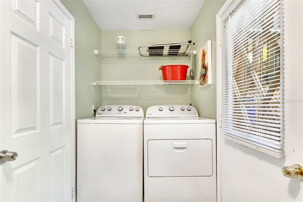412 80th Street Holmes Beach, FL 34217 - Photo 39 of 58 a utility room with dryer and washer