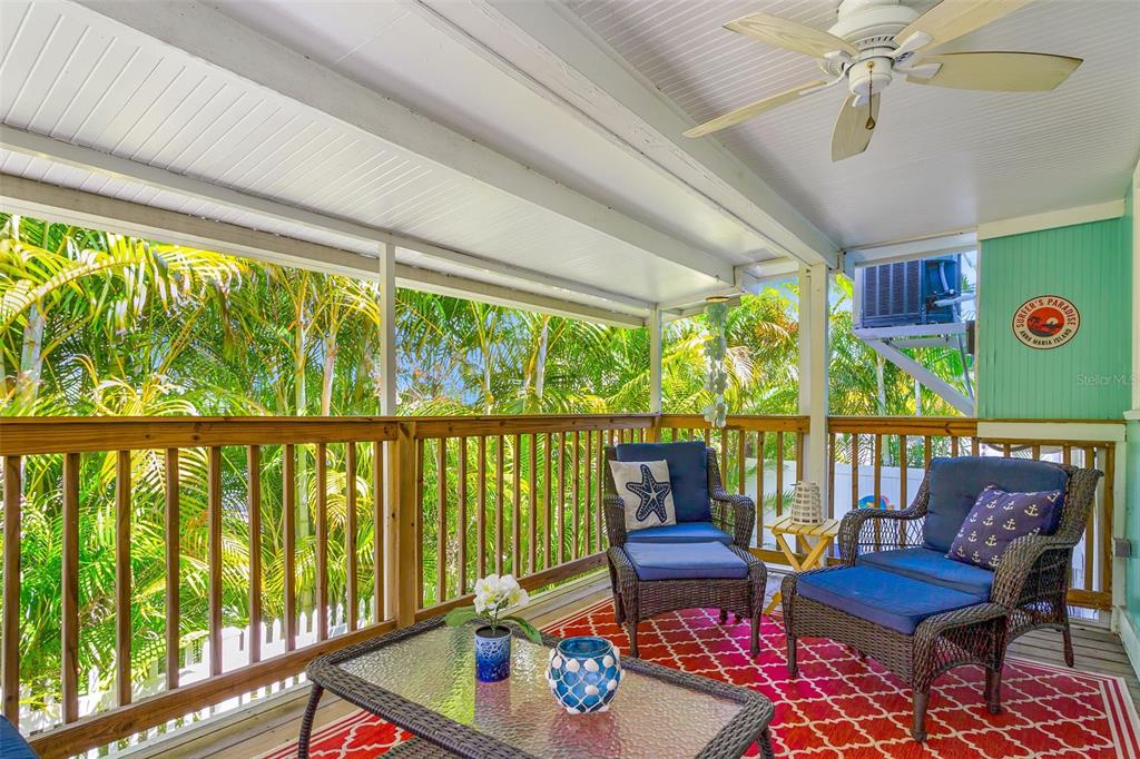 412 80th Street Holmes Beach, FL 34217 - Photo 41 of 58 a living room with furniture and a large window
