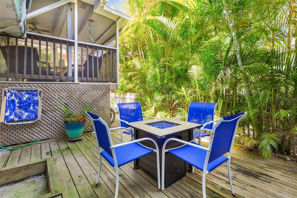 412 80th Street Holmes Beach, FL 34217 - Photo 43 of 58 a view of a chairs and table in the balcony