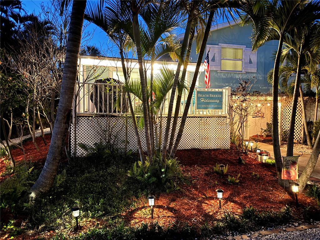 412 80th Street Holmes Beach, FL 34217 - Photo 48 of 58 a view of a backyard