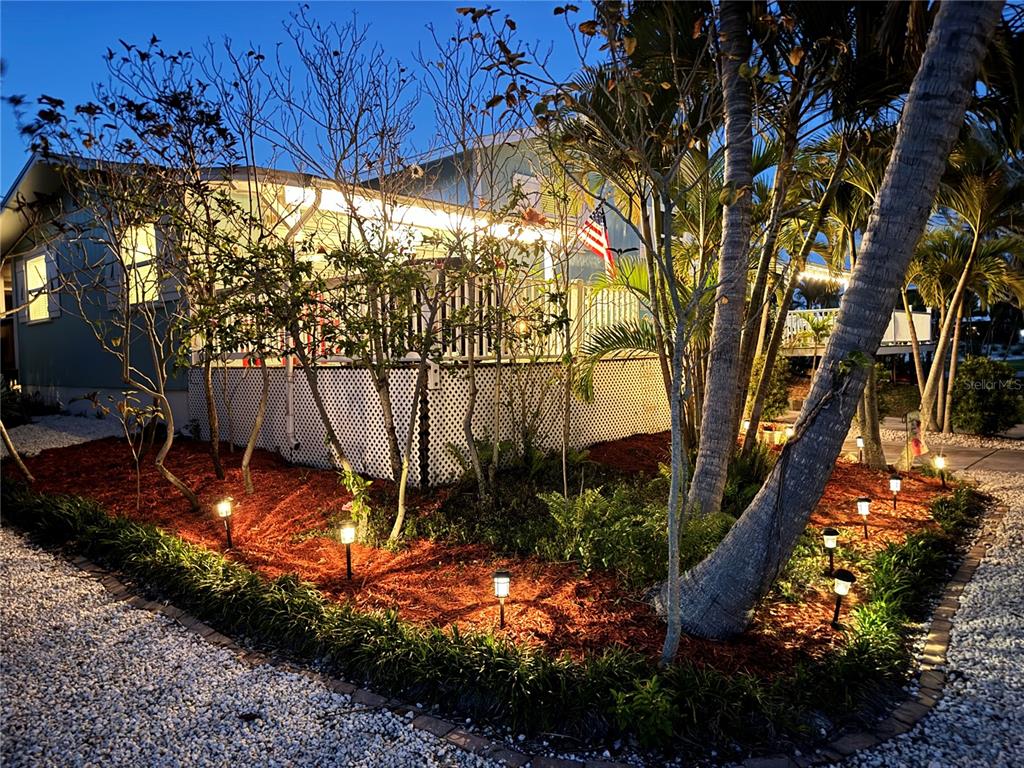 412 80th Street Holmes Beach, FL 34217 - Photo 49 of 58 a view of an outdoor space and yard