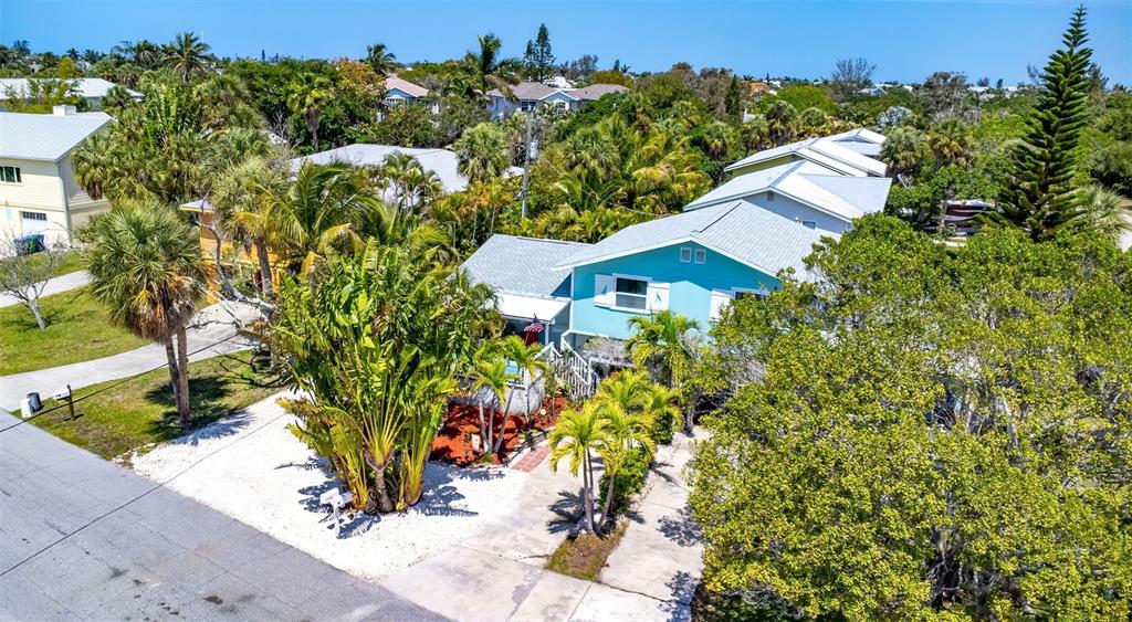 412 80th Street Holmes Beach, FL 34217 - Photo 51 of 58 an aerial view of a house with a yard