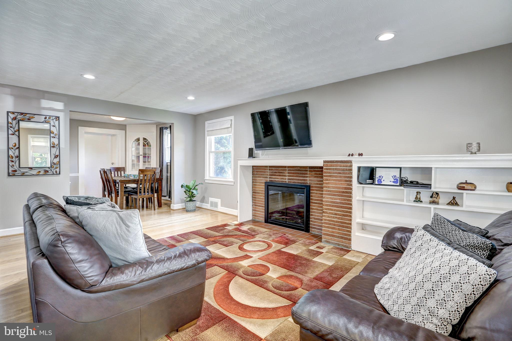 1804 Republic Road Silver Spring, MD 20902 - Photo 2 of 25 Wood burning fireplace, and built-in shelving