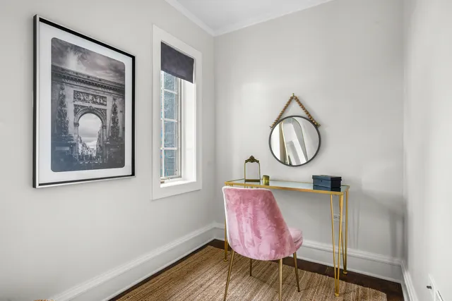 a front view of a house with wooden floor and windows
