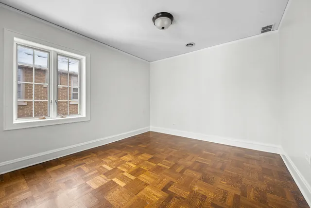 a view of an empty room with a window