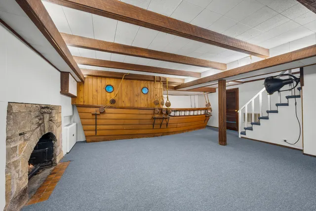 a view of an empty room with stairs