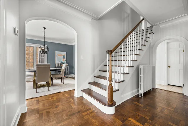 a view of entryway with stairs and wooden floor