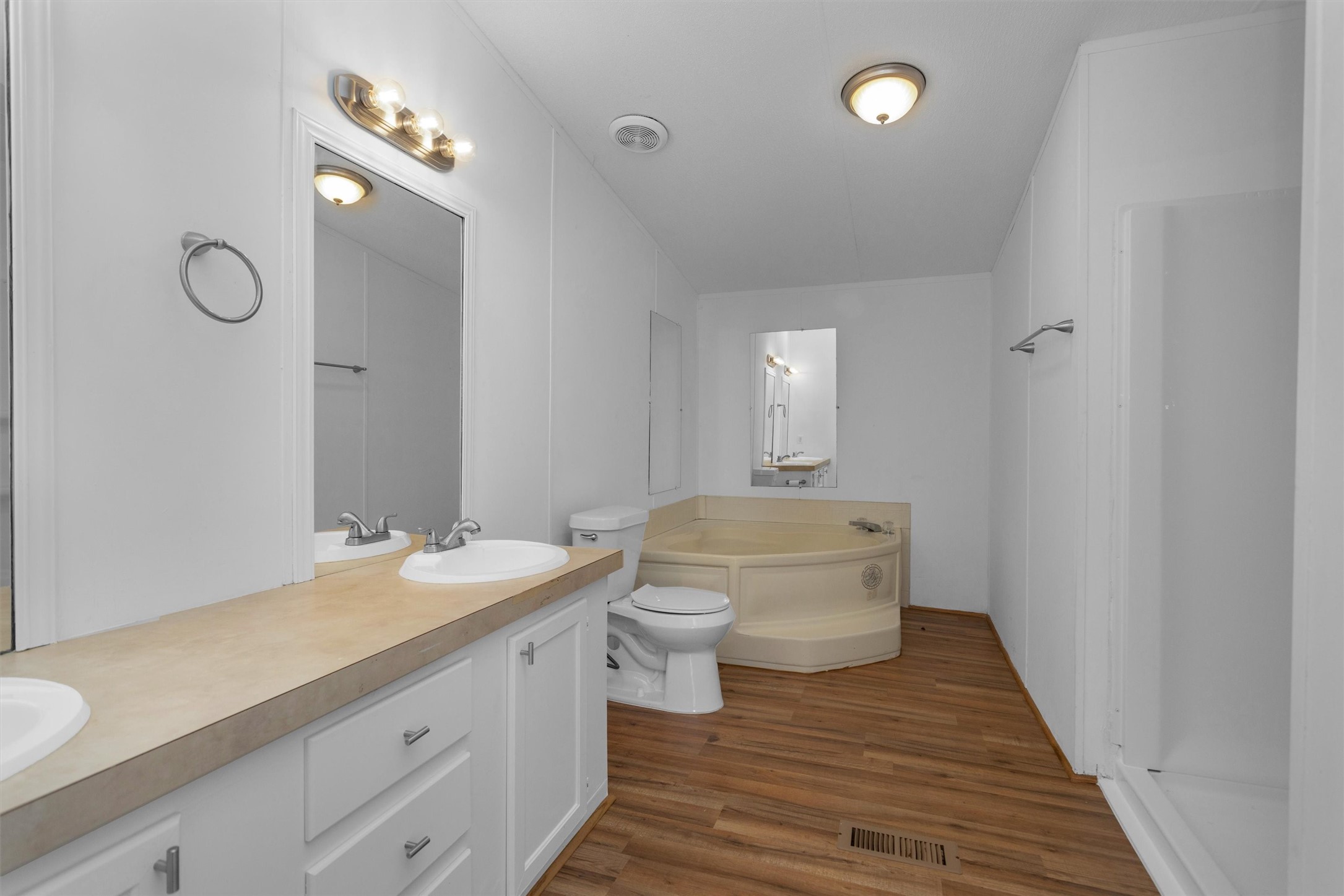 16426 Trenda Court Conroe, TX 77306 - Photo 21 of 35 a bathroom with a double vanity sink toilet and shower