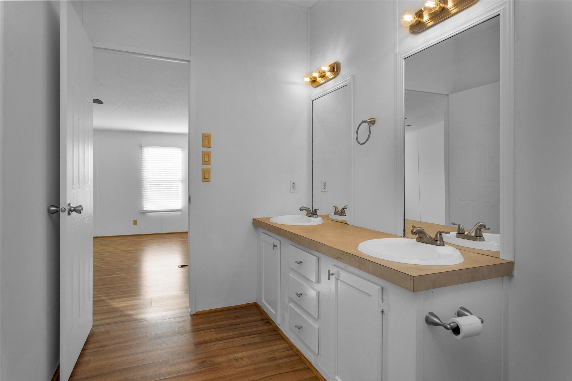 16426 Trenda Court Conroe, TX 77306 - Photo 23 of 35 a spacious bathroom with a double vanity sink and mirror