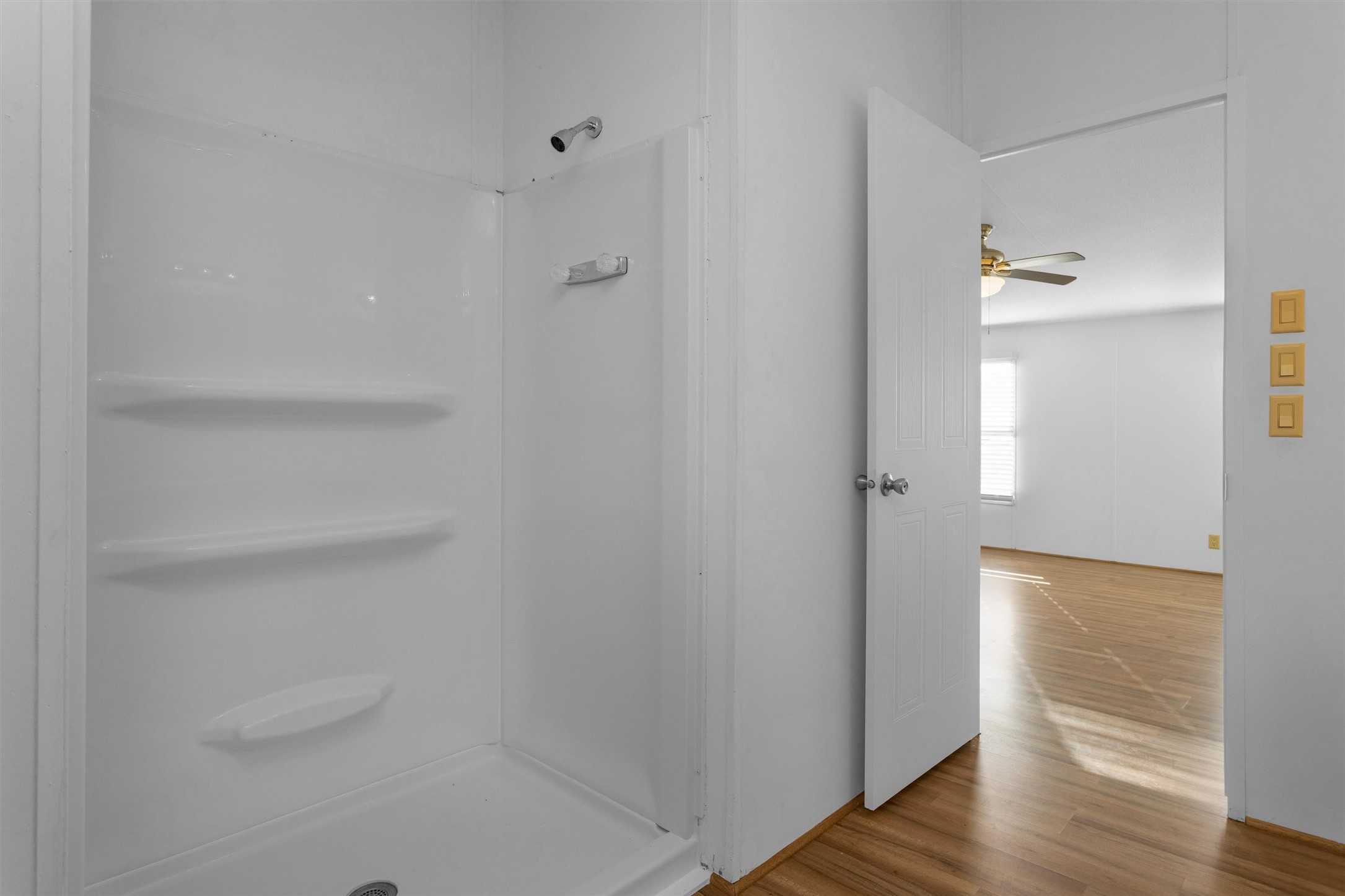 16426 Trenda Court Conroe, TX 77306 - Photo 24 of 35 a view of a hallway with wooden floor