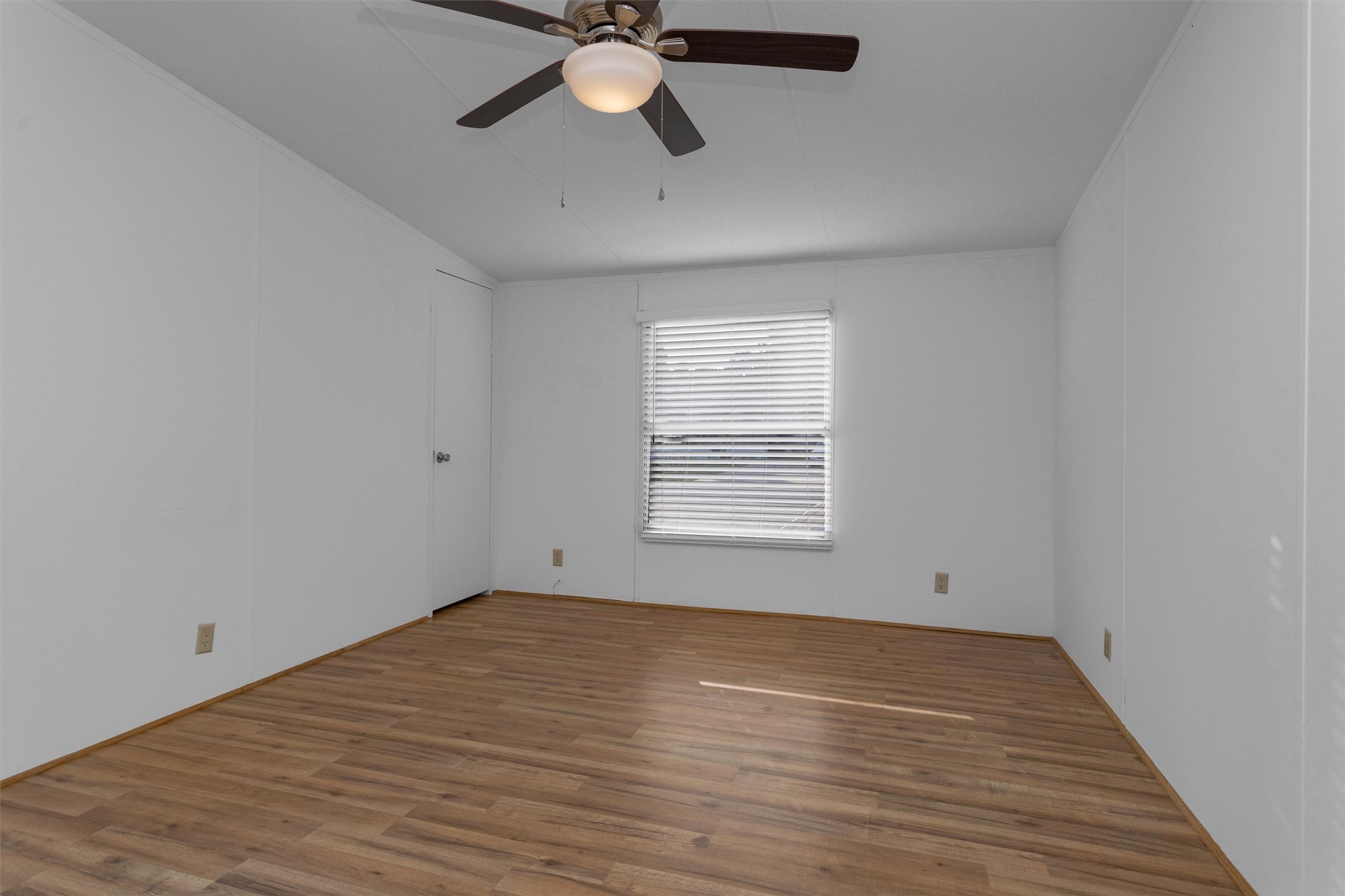 16426 Trenda Court Conroe, TX 77306 - Photo 25 of 35 wooden floor in an empty room with a window
