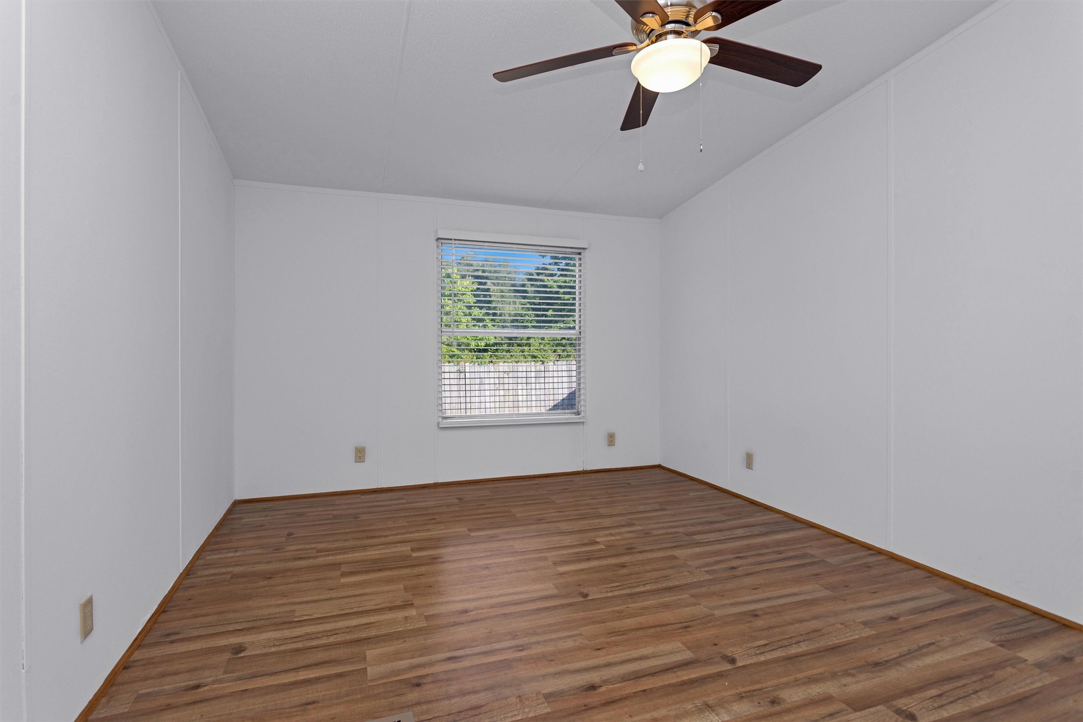 16426 Trenda Court Conroe, TX 77306 - Photo 28 of 35 wooden floor in an empty room with a window