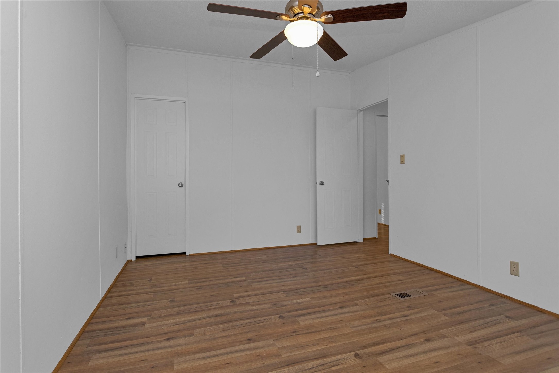 16426 Trenda Court Conroe, TX 77306 - Photo 29 of 35 a view of an empty room with wooden floor
