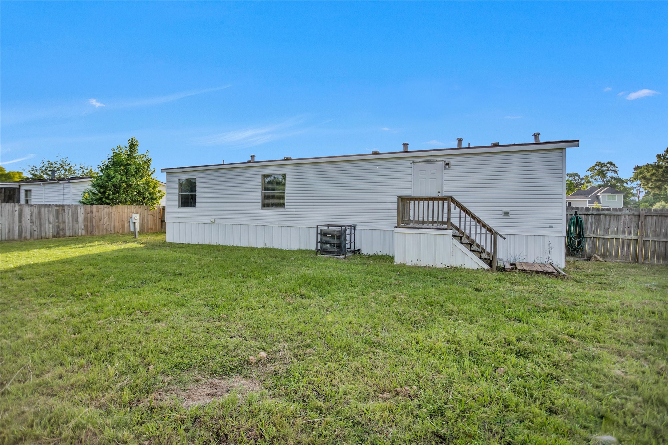 16426 Trenda Court Conroe, TX 77306 - Photo 31 of 35 a view of a backyard with plants and large trees