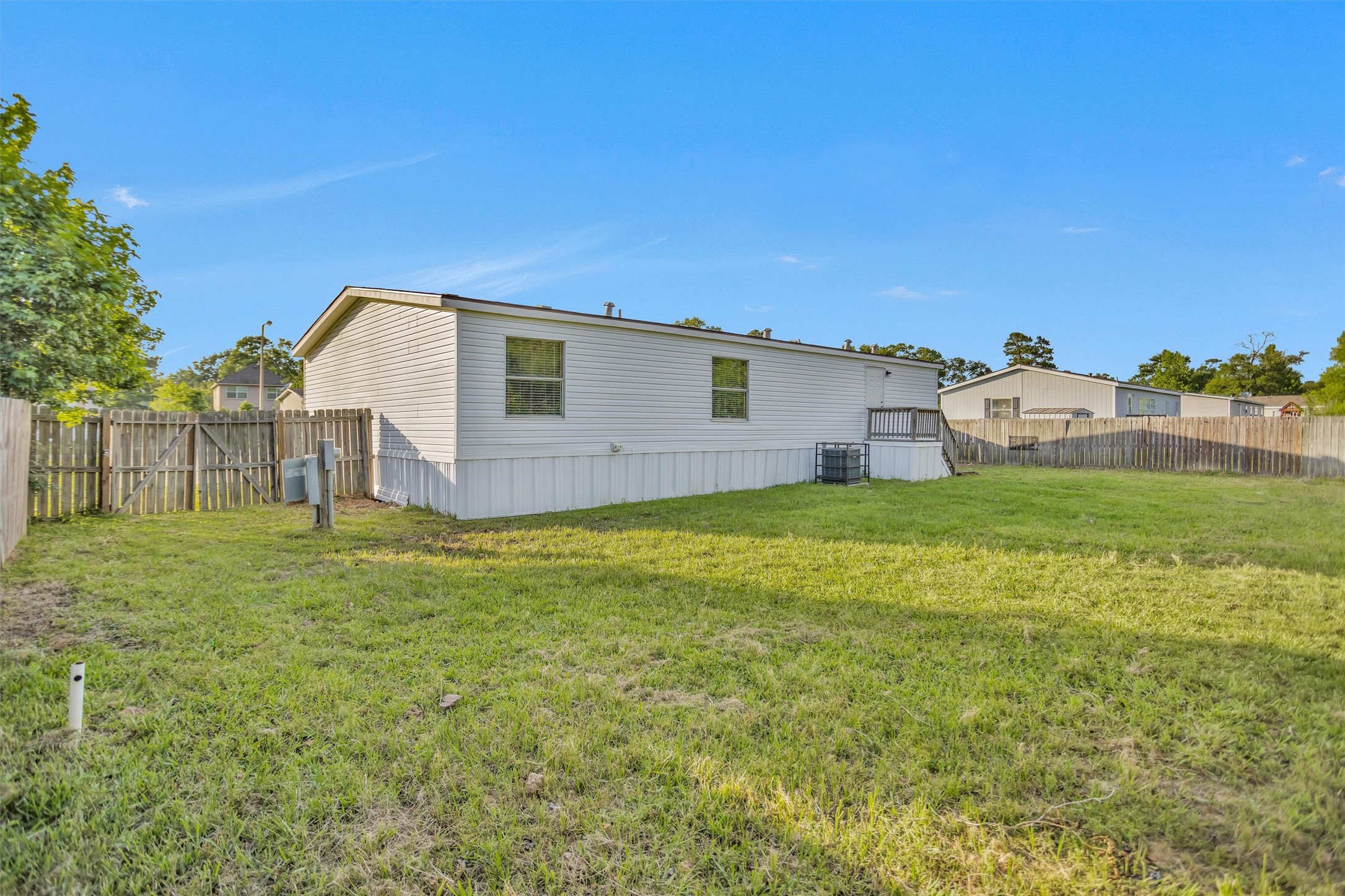 16426 Trenda Court Conroe, TX 77306 - Photo 33 of 35 a view of a house with a yard