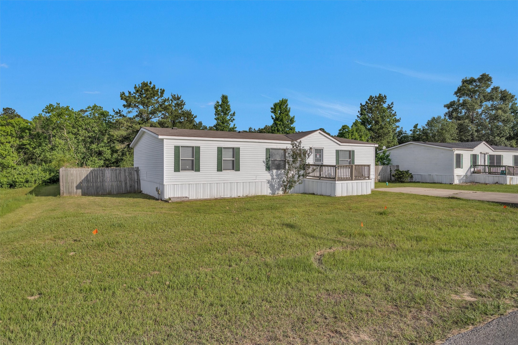 16426 Trenda Court Conroe, TX 77306 - Photo 4 of 35 a front view of a house with garden