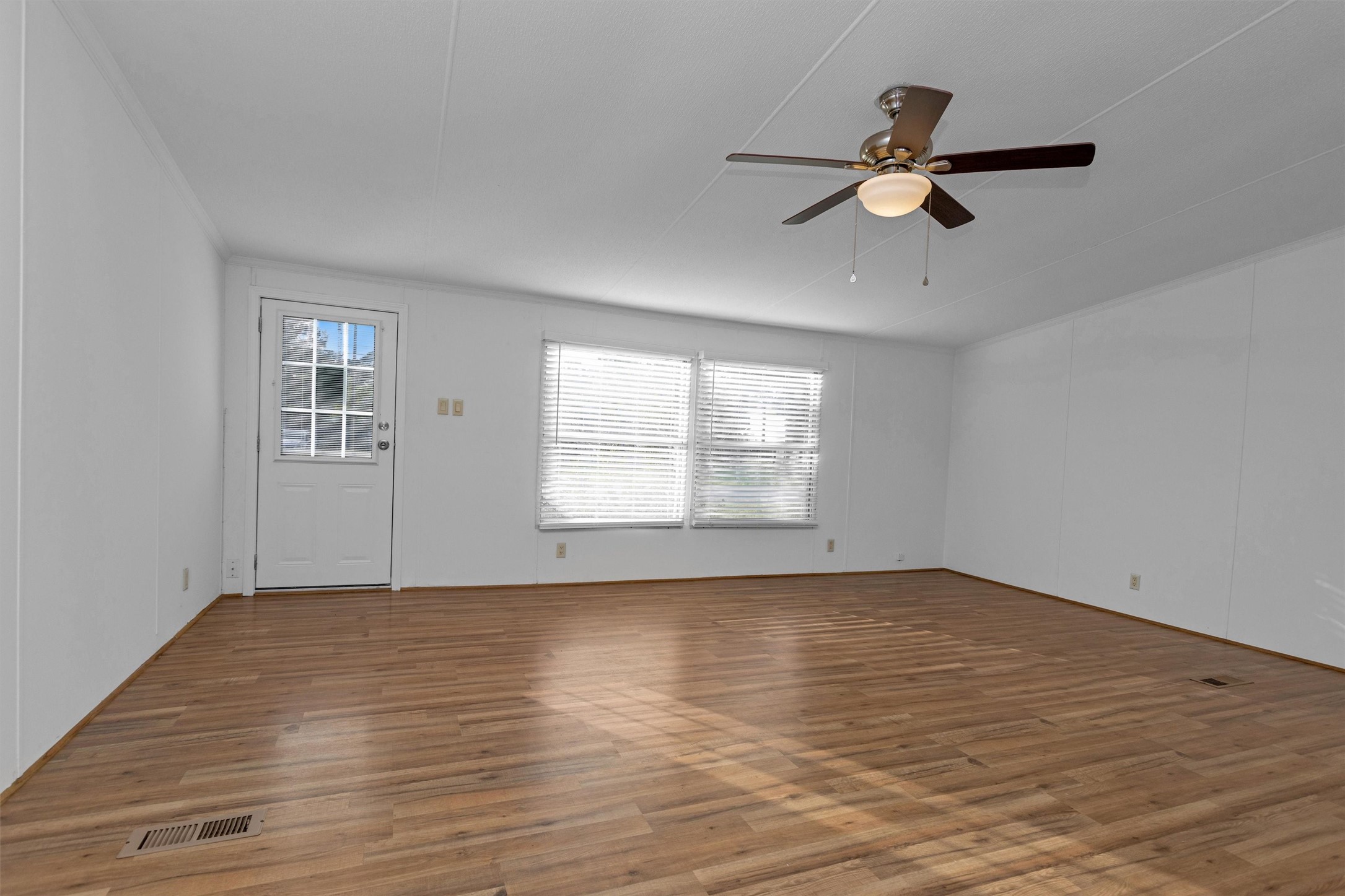 16426 Trenda Court Conroe, TX 77306 - Photo 6 of 35 a view of empty room with wooden floor and fan