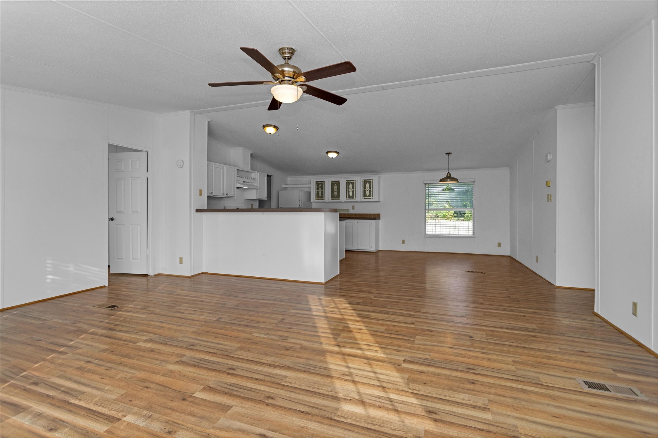 16426 Trenda Court Conroe, TX 77306 - Photo 7 of 35 a view of empty room with wooden floor and window