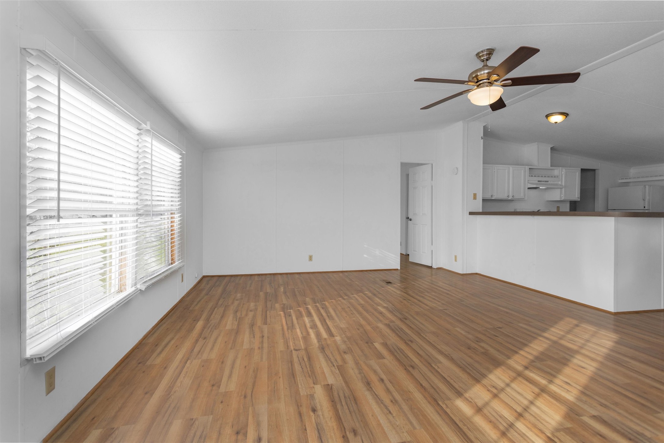 16426 Trenda Court Conroe, TX 77306 - Photo 8 of 35 a view of empty room with wooden floor and fan