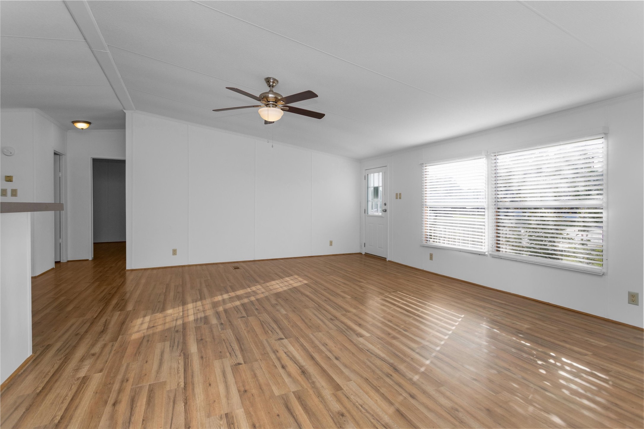 16426 Trenda Court Conroe, TX 77306 - Photo 9 of 35 a view of empty room with wooden floor and fan
