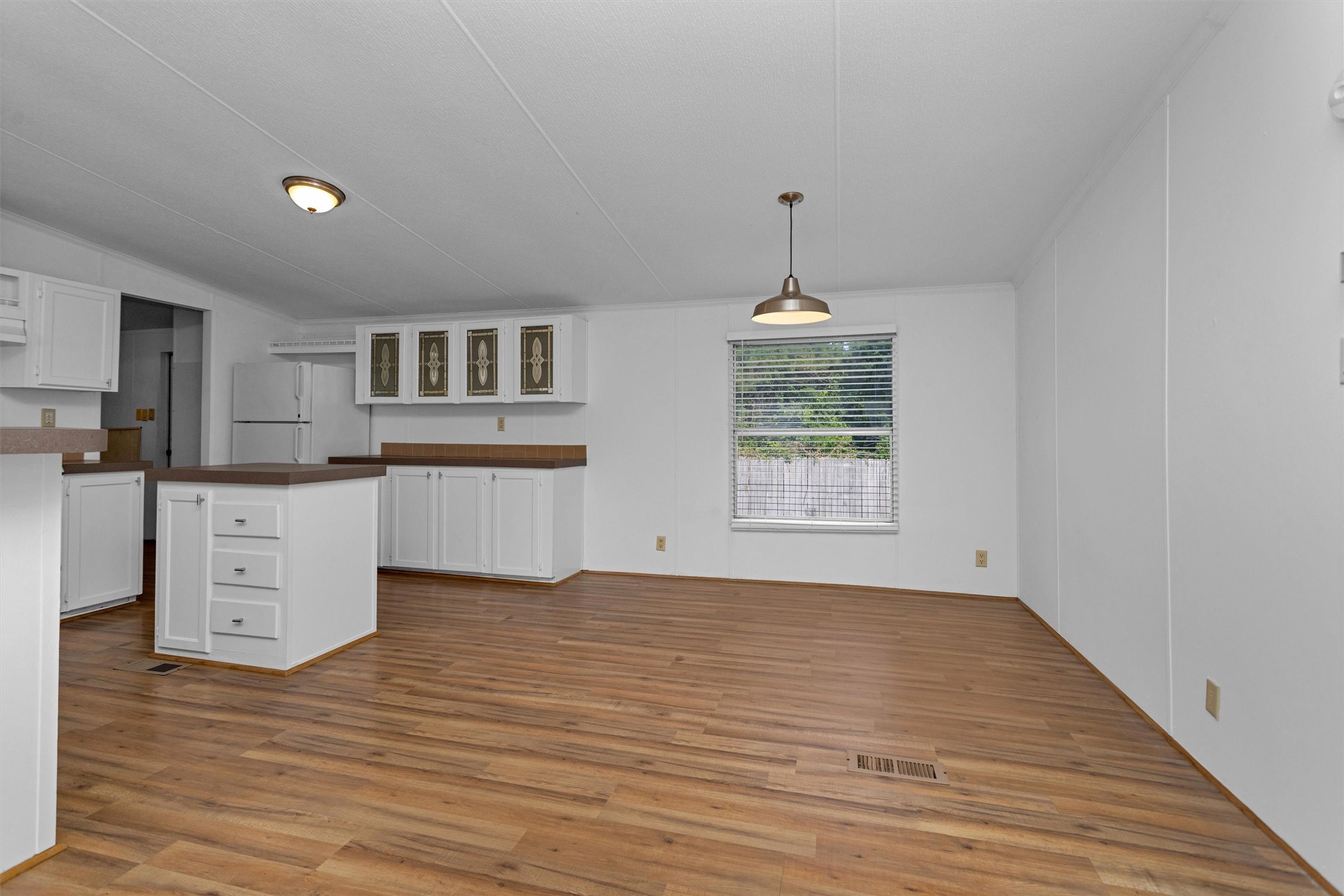 16426 Trenda Court Conroe, TX 77306 - Photo 10 of 35 a view of kitchen with wooden floor and electronic appliances