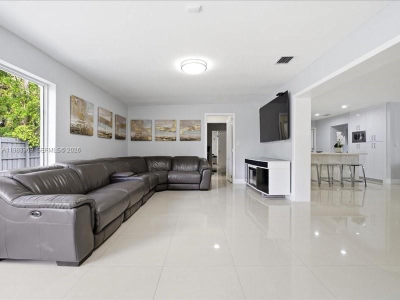 3345 Southwest 109th Court Miami, FL 33165 - Photo 12 of 41 a living room with furniture and a flat screen tv