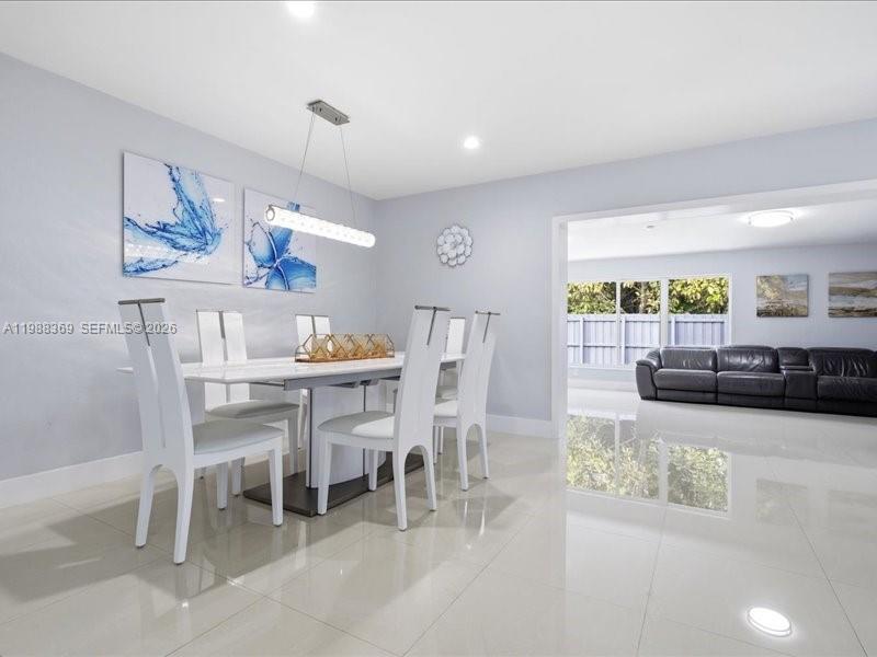 3345 Southwest 109th Court Miami, FL 33165 - Photo 14 of 41 a view of a dining room with furniture