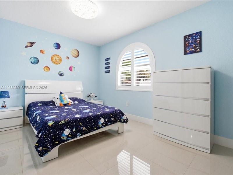 3345 Southwest 109th Court Miami, FL 33165 - Photo 19 of 41 a bedroom with a bed and a window