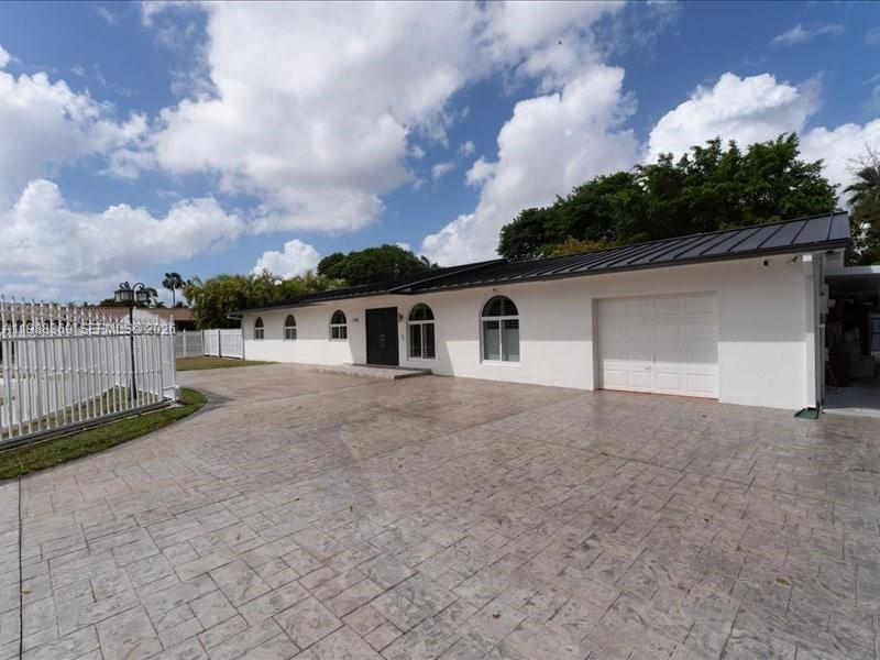 3345 Southwest 109th Court Miami, FL 33165 - Photo 2 of 41 a view of a house with a backyard