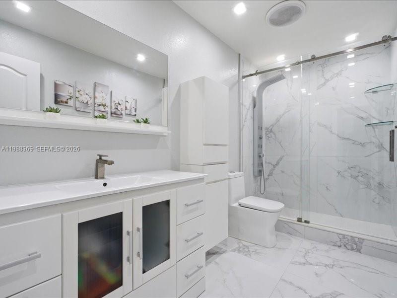 3345 Southwest 109th Court Miami, FL 33165 - Photo 21 of 41 a bathroom with a sink toilet and shower