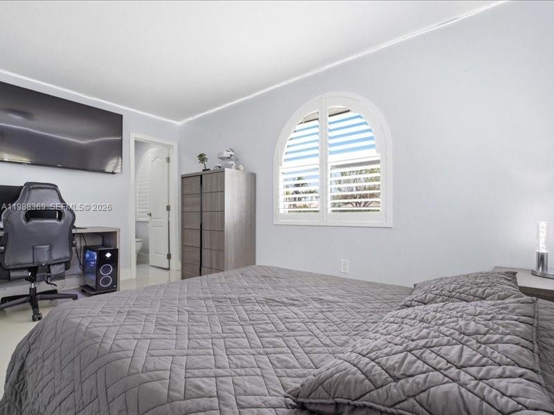3345 Southwest 109th Court Miami, FL 33165 - Photo 23 of 41 a bedroom with a bed dresser and a window