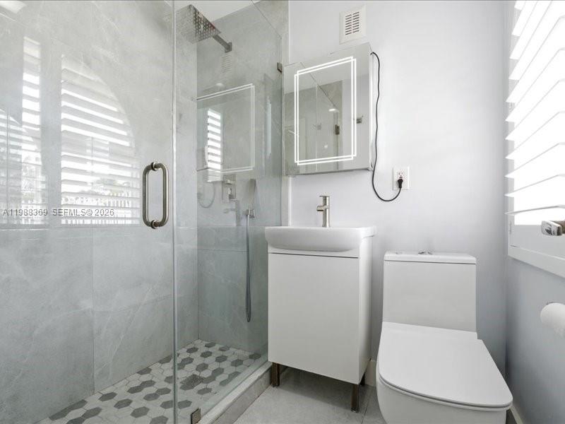 3345 Southwest 109th Court Miami, FL 33165 - Photo 24 of 41 a bathroom with a toilet sink and shower