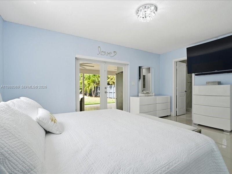 3345 Southwest 109th Court Miami, FL 33165 - Photo 26 of 41 a bedroom with a bed and a flat screen tv
