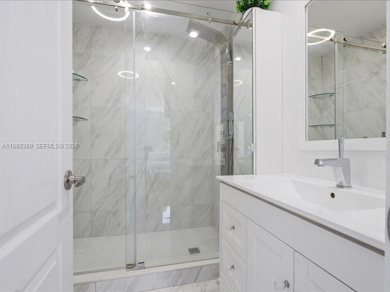3345 Southwest 109th Court Miami, FL 33165 - Photo 28 of 41 a bathroom with a shower and a sink