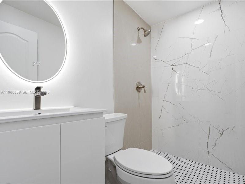 3345 Southwest 109th Court Miami, FL 33165 - Photo 30 of 41 a white toilet sitting next to a bathroom sink