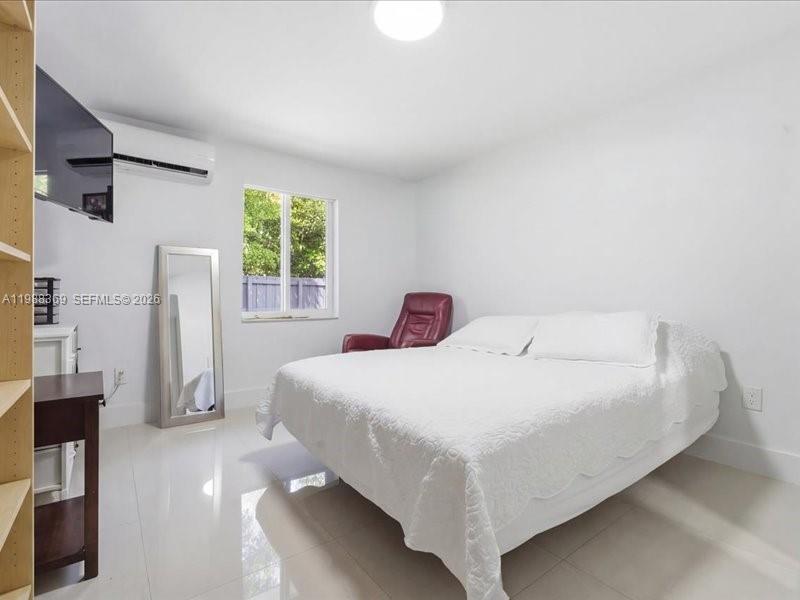 3345 Southwest 109th Court Miami, FL 33165 - Photo 32 of 41 a bedroom with a bed and a window