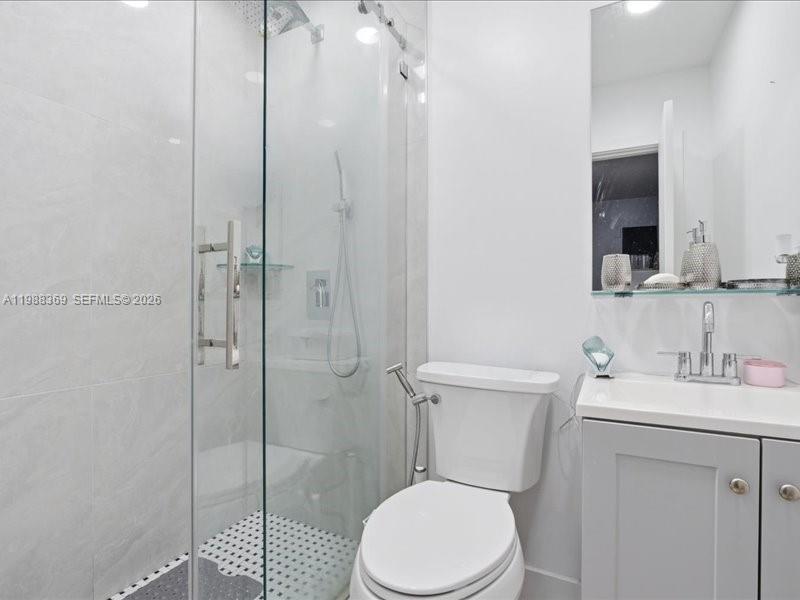 3345 Southwest 109th Court Miami, FL 33165 - Photo 34 of 41 a white toilet sitting next to a bathroom sink