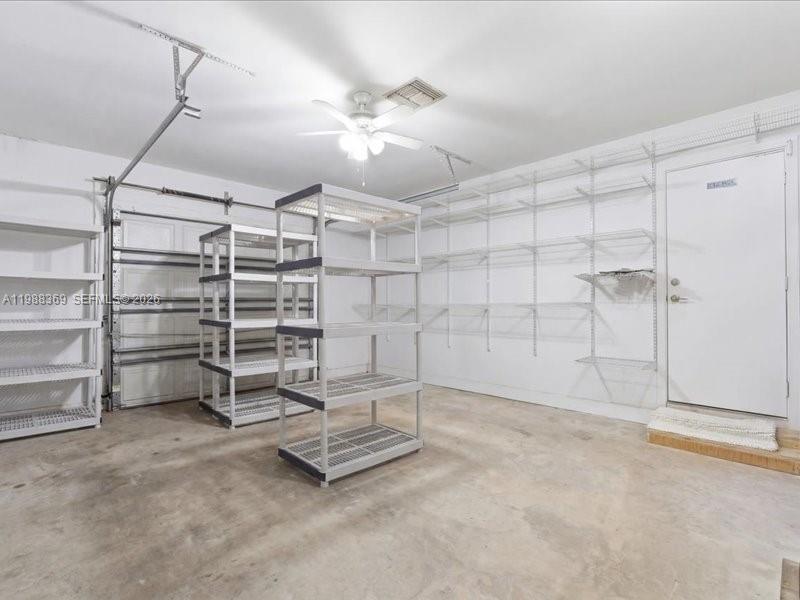 3345 Southwest 109th Court Miami, FL 33165 - Photo 35 of 41 a view of a room with racks on the wall