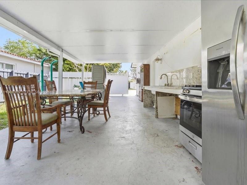 3345 Southwest 109th Court Miami, FL 33165 - Photo 36 of 41 a view of a dining room with furniture window and outside view