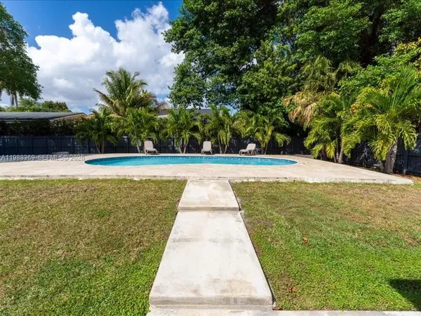 a view of swimming pool with seating space