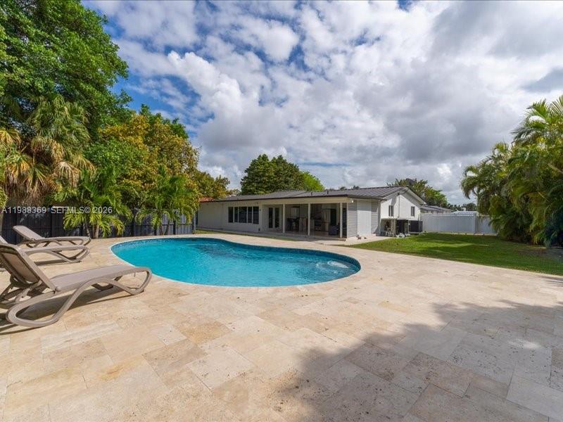 3345 Southwest 109th Court Miami, FL 33165 - Photo 40 of 41 a view of a house with a swimming pool