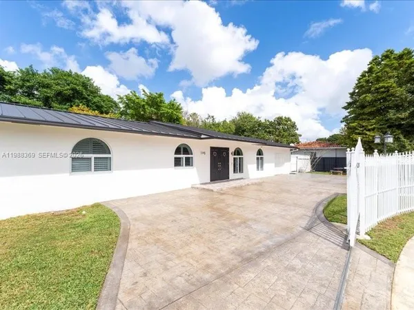 a house view with a backyard space