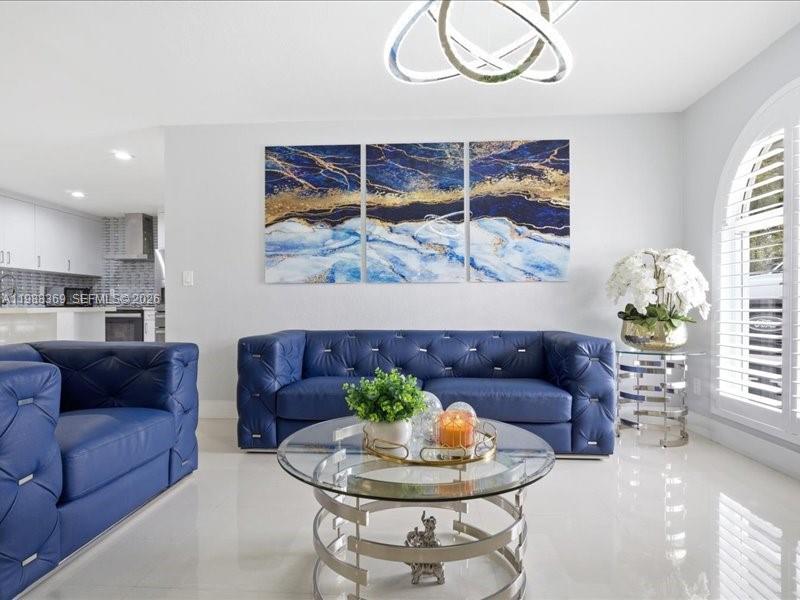 3345 Southwest 109th Court Miami, FL 33165 - Photo 9 of 41 a living room with furniture and a painting