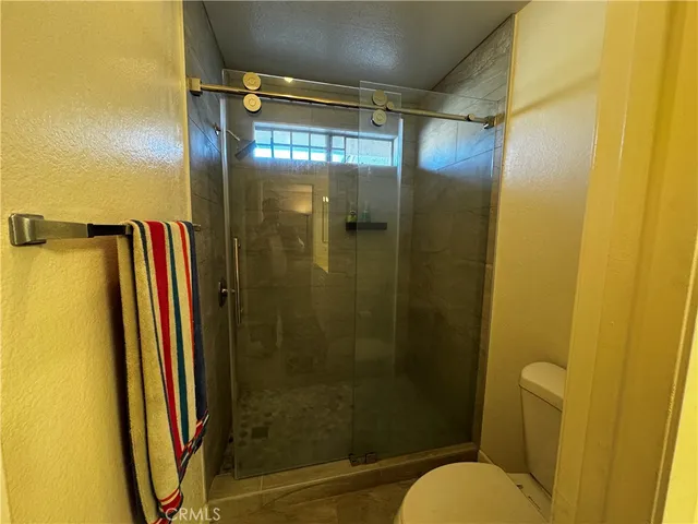 a view of a chairs and table in a patio