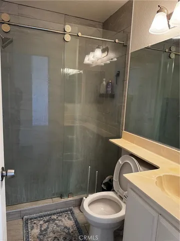 a view of a lake with houses in the background